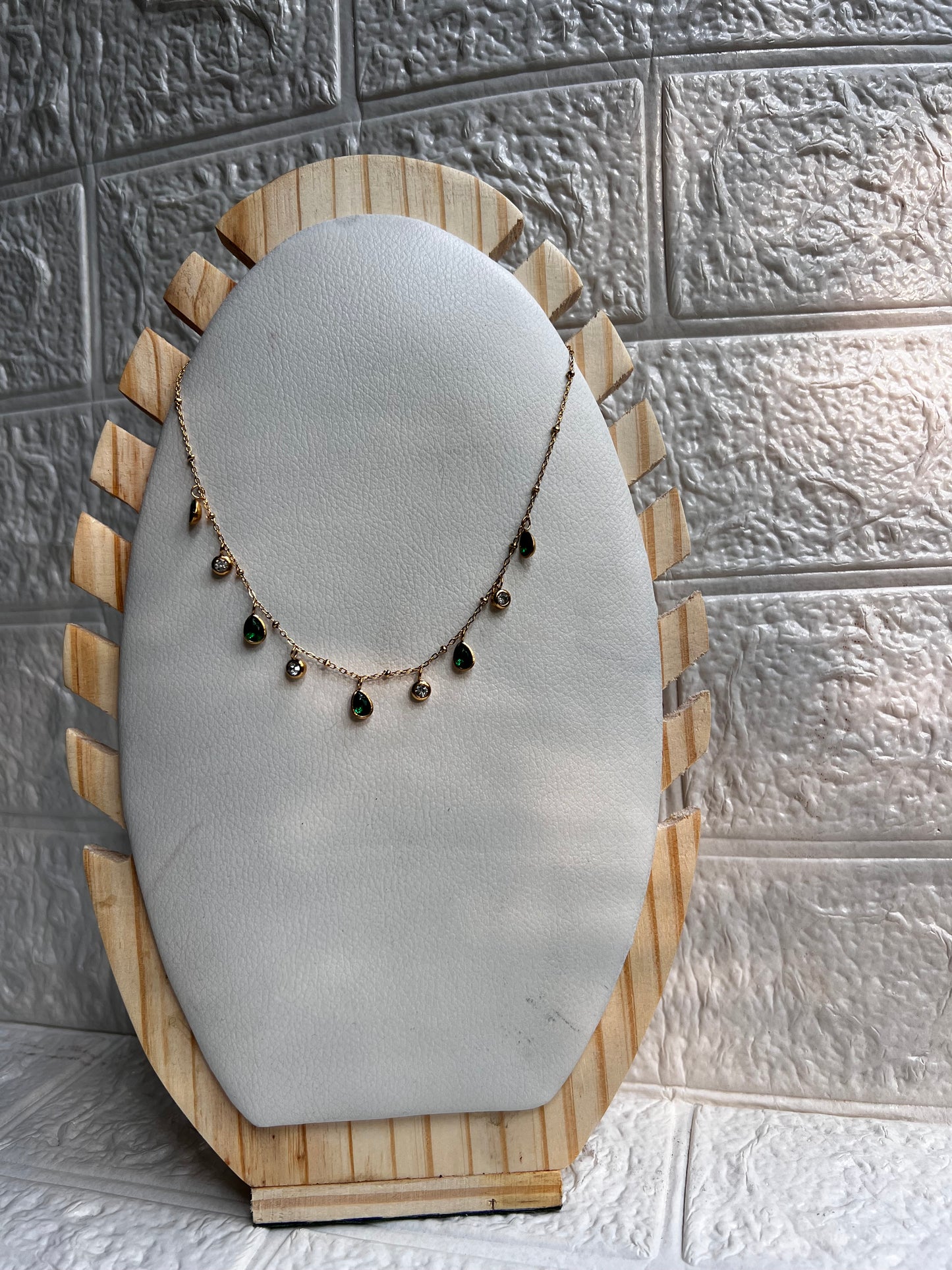 Green and white charm necklace