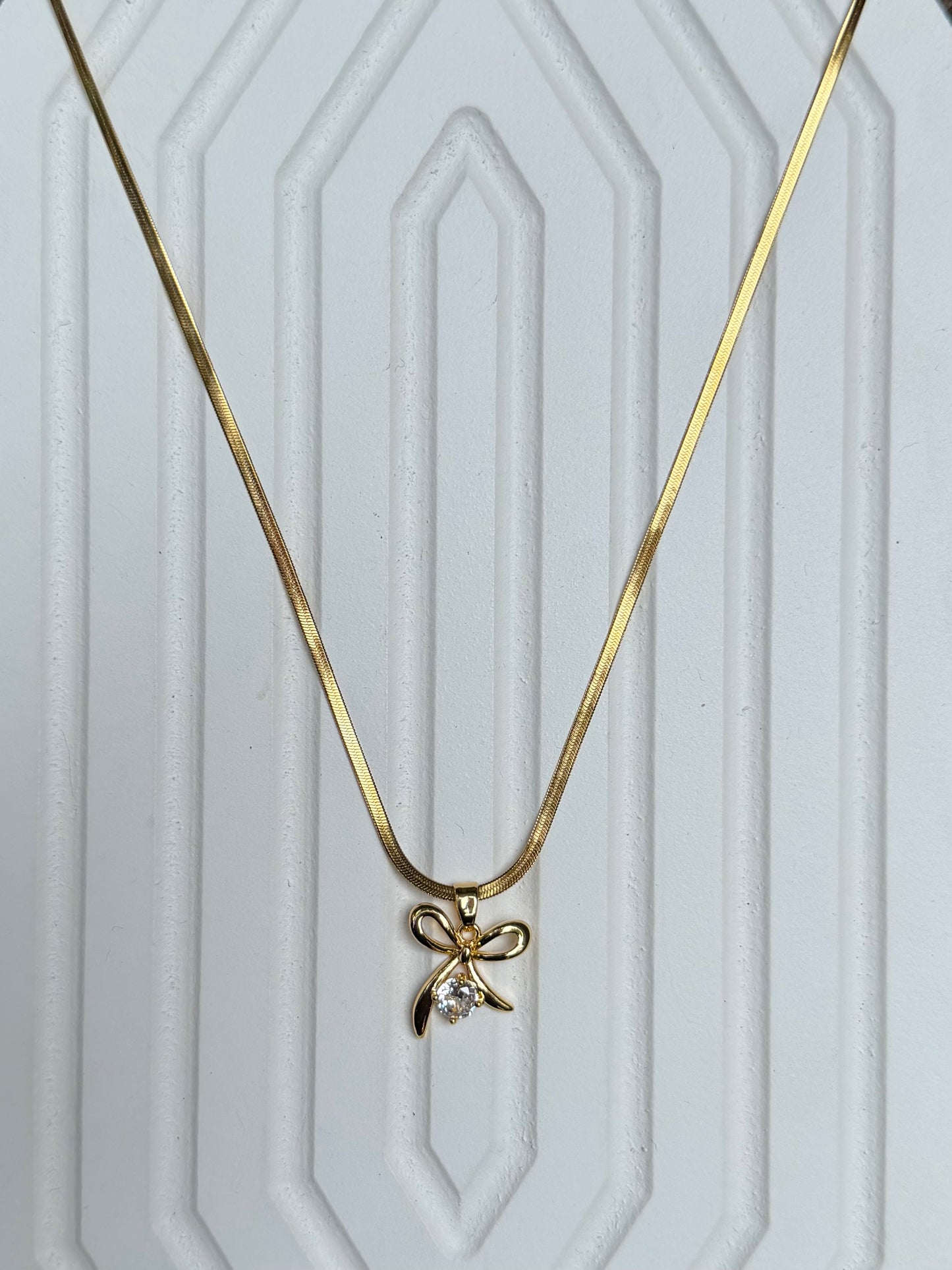 Stone bow pendant