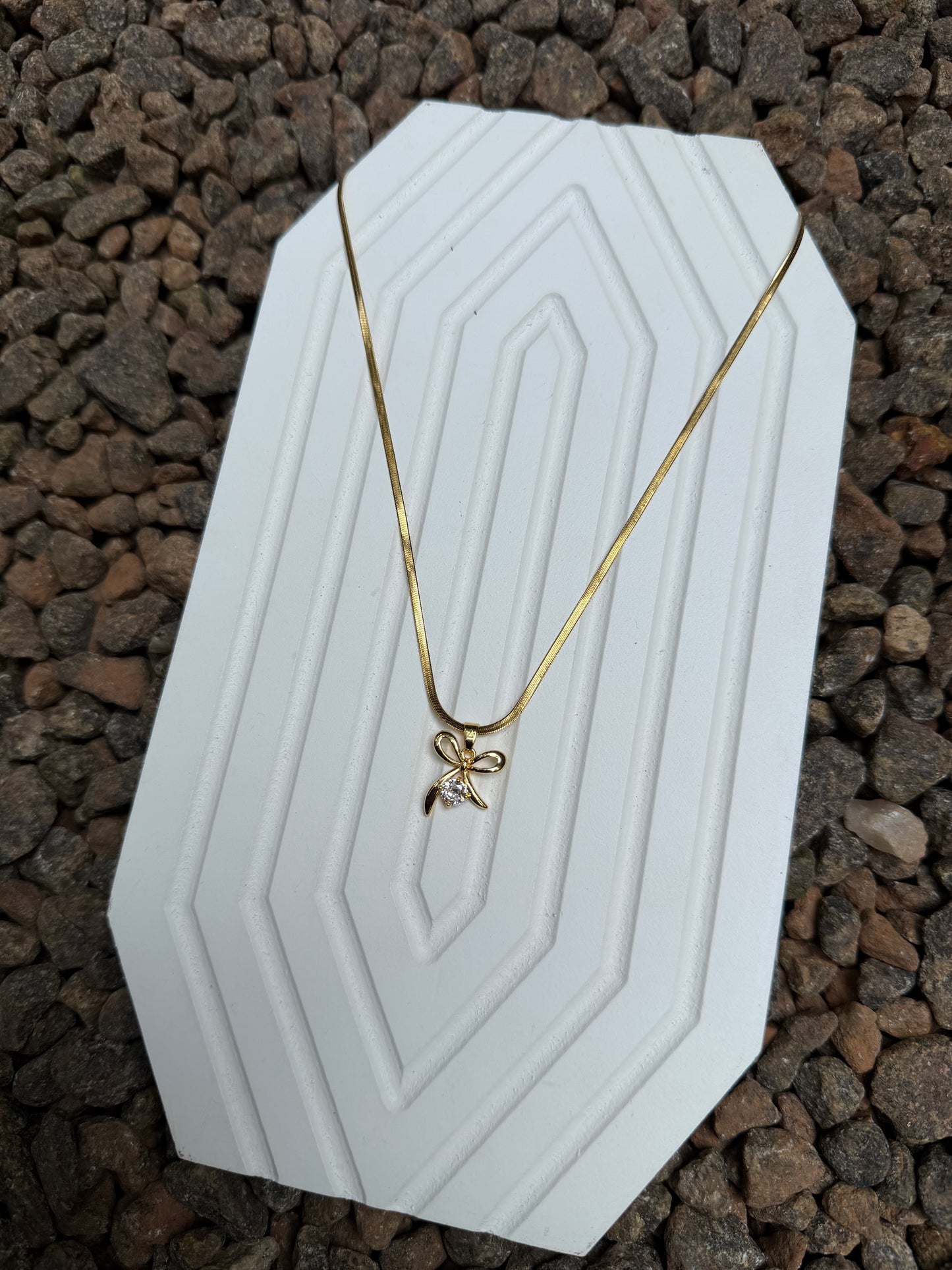 Stone bow pendant